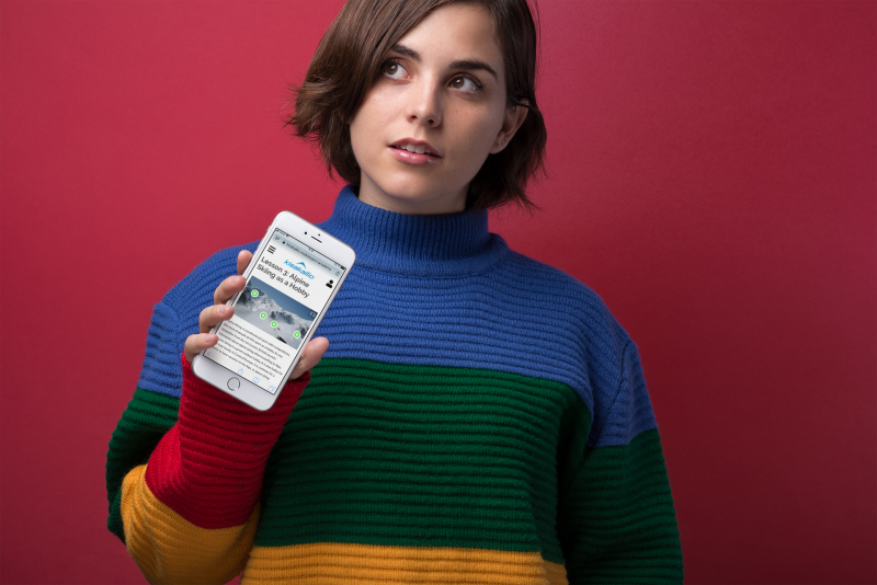 iphone-8-mockup-featuring-a-short-haired-girl-in-a-mock-neck-sweater-against-a-red-wall-21830